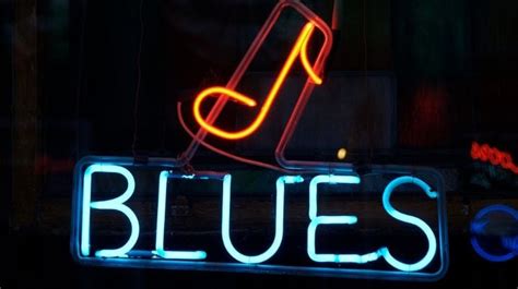 what is likely true about the genre of music known as blues? how does the melancholic quality of the blues reflect broader societal issues?